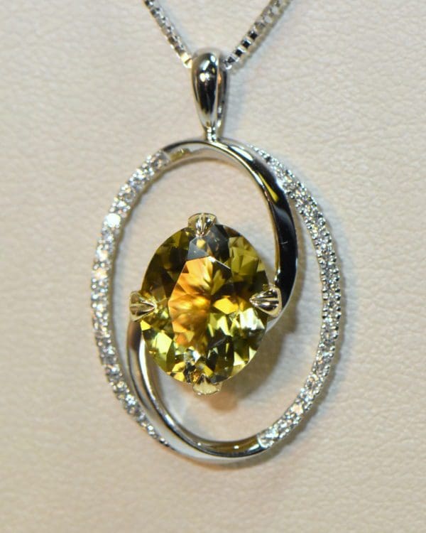 yellow and pink pendant bicolor tourmaline in oval diamond frame 5.JPG