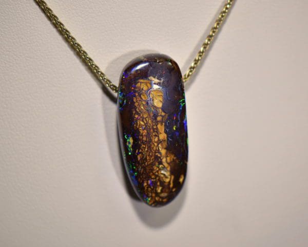 australian boulder opal drilled slide pendant on 18k gold chain.JPG