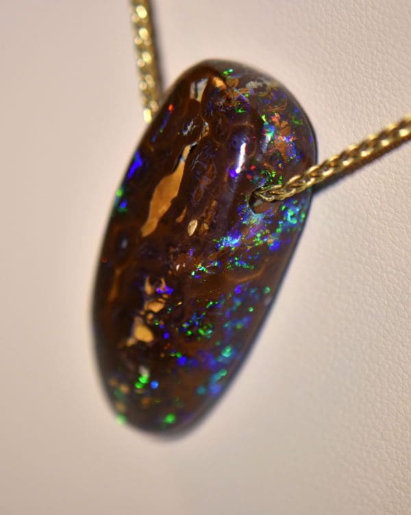 australian boulder opal drilled slide pendant on 18k gold chain 2.JPG