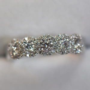 diamond 5 stone anniversary band with halo design white gold.JPG