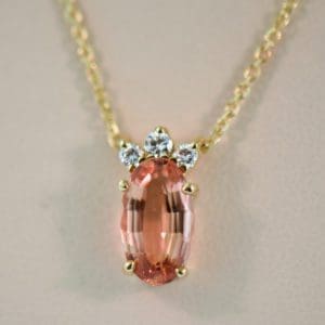 elegant estate pendant with diamonds and orange imperial topaz