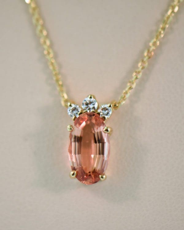 elegant estate pendant with diamonds and orange imperial topaz