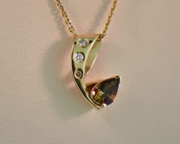 estate andalusite pendant with diamond accents