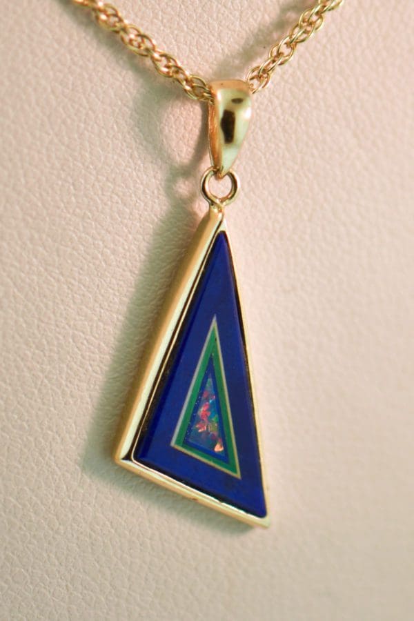 estate intarsia pendant in gold with opal malachite and lapis