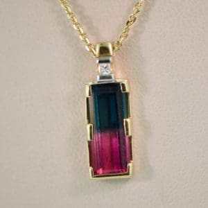 rare bicolor red blue tourmaline pendant in gold