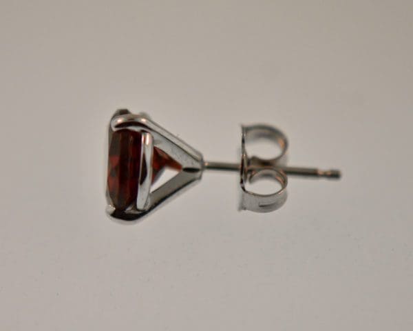 red garnet three prong martini stud earrings 3