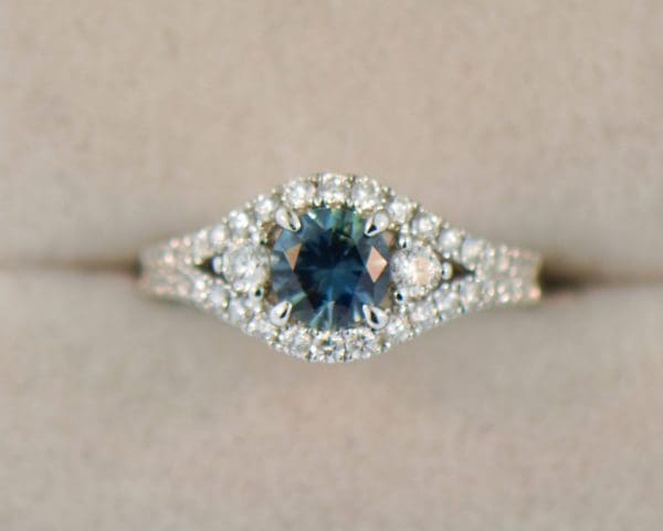 round teal sapphire and diamond engagement ring white gold