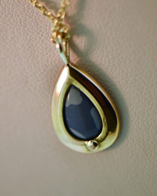 vintage gold pendant bezel set with gem grade black opal 4