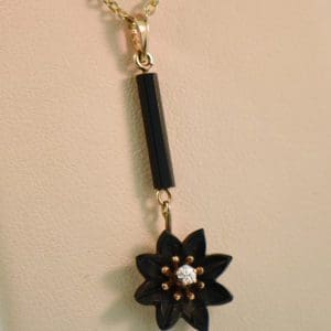 antique carved black onyx and diamond daisy flower pendant
