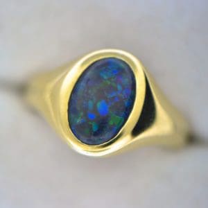 gents ring with australian black opal with blue green hues