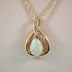 modern estate white pear shaped opal and diamond pendant