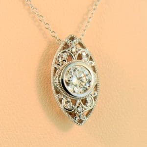 1ct round diamond eye pendant in white gold filigree
