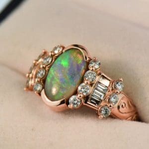 custom rose gold cocktail ring with baguette diamonds and australian opal