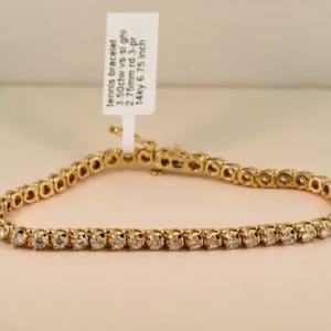 extra fine yellow gold and diamond three prong tennis bracelet 3