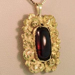 antique georgian cabochon garnet and floral gold pendant