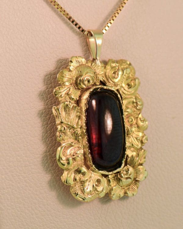 antique georgian cabochon garnet and floral gold pendant