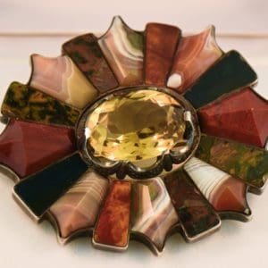 antique scottish agate pebble brooch with cairngorm citrine and agate inlay