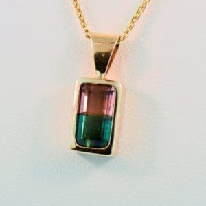 bicolor watermelon tourmaline pendant in 14k yellow bezel