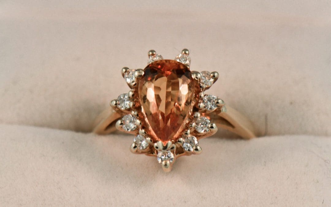 estate pear shape precious topaz and diamond halo ring