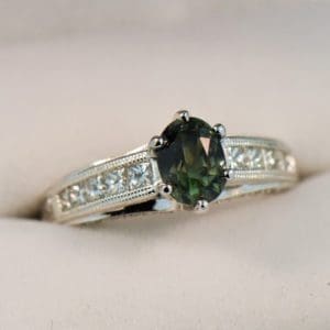 natural forest green sapphire and channel set diamond engagement ring