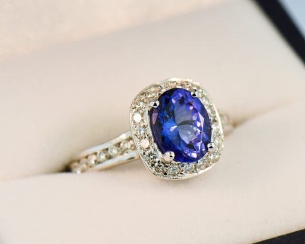 oval tanzanite and diamond halo ring white gold