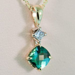 teal tourmaline and diamond pendant in gold