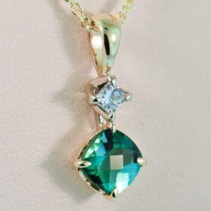 teal tourmaline and diamond pendant in gold