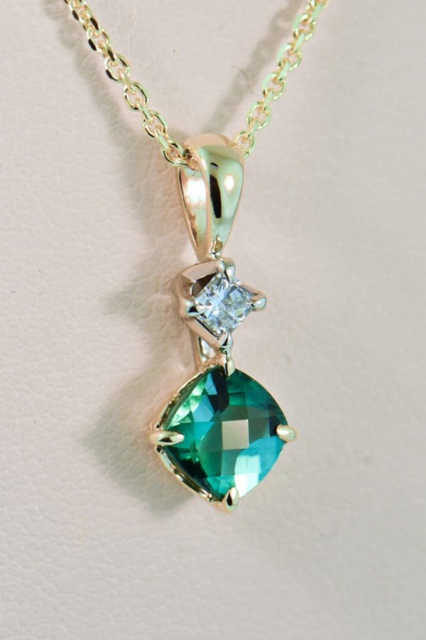 teal tourmaline and diamond pendant in gold