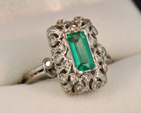 vintage platinum ring with filigree diamonds and elongated emerald 4