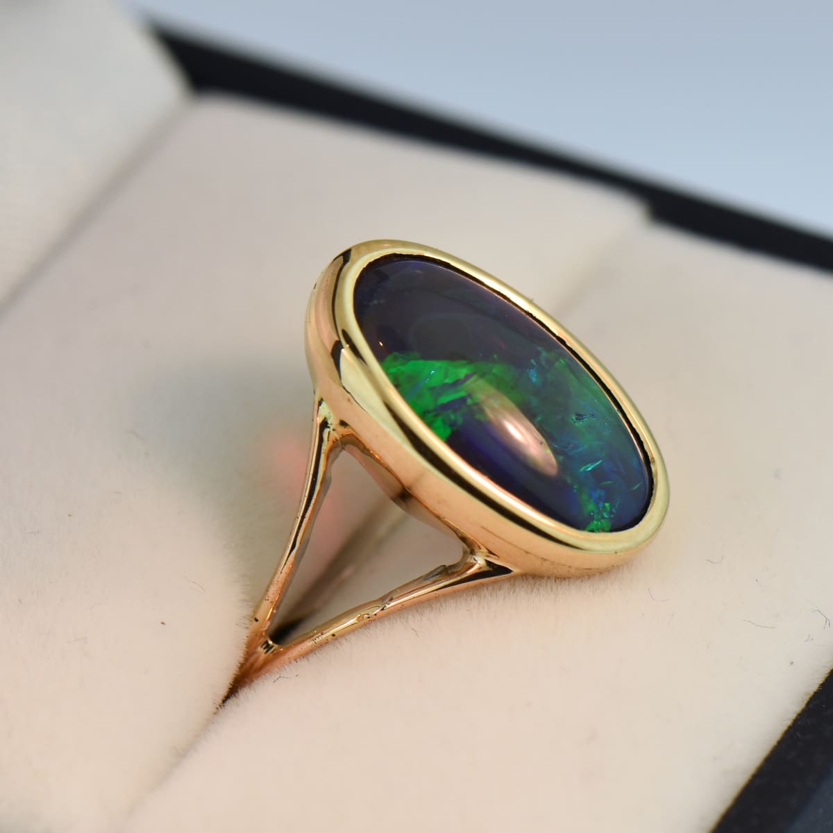 Black Crystal Opal Solitaire Ring in Yellow Gold Bezel