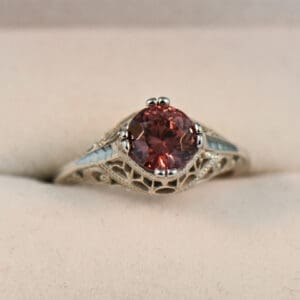 art deco die struck white gold ring with round rose zircon