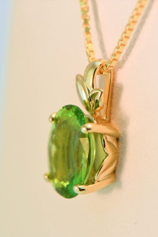 burmese peridot solitaire pendant with leaf trim 2