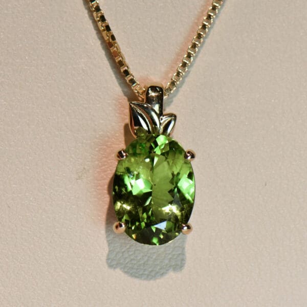 burmese peridot solitaire pendant with leaf trim 3