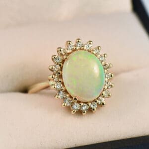 classic australian opal and diamond diana style halo ring