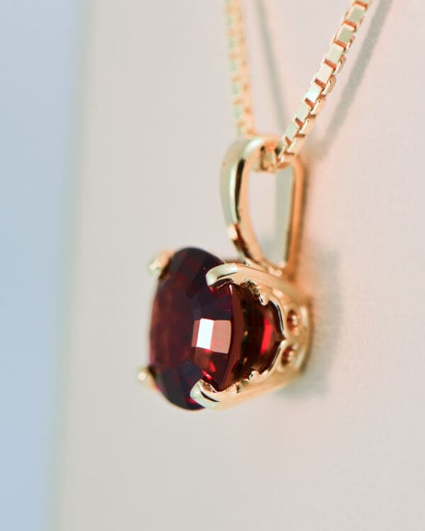 cushion cut red garnet solitaire pendant in gold