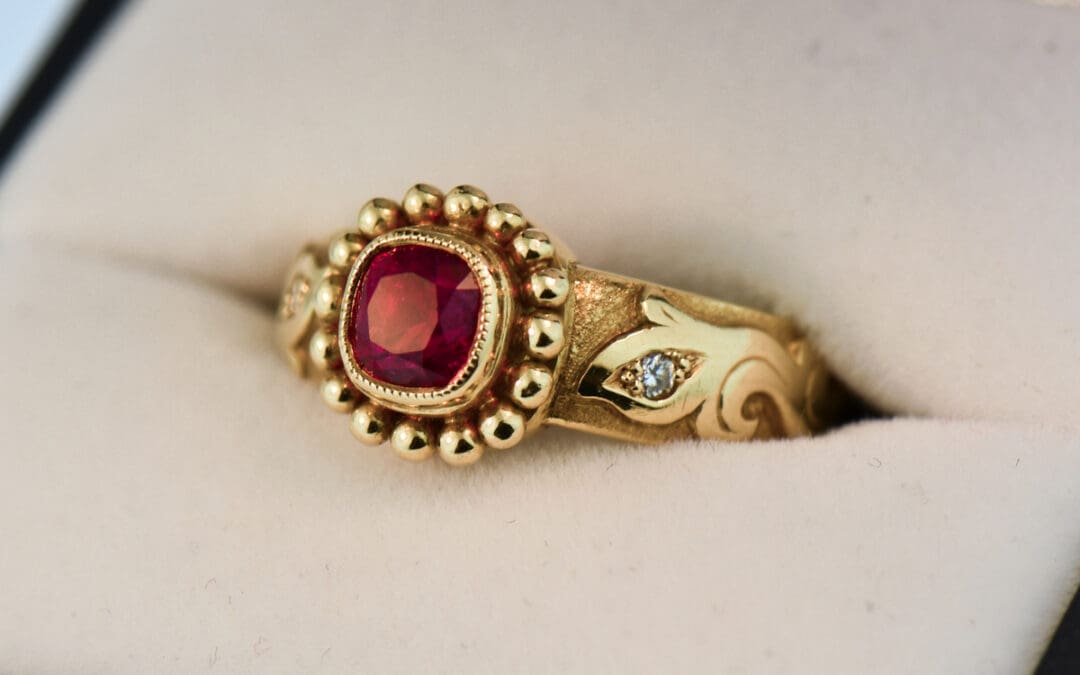 custom carved gold band style ring with bezel set jedi red spinel