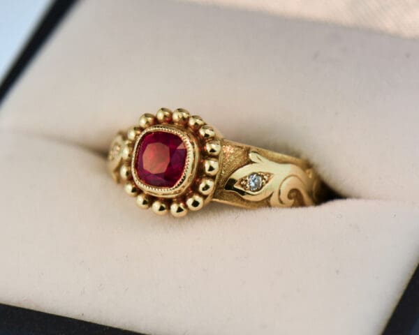 custom carved gold band style ring with bezel set jedi red spinel