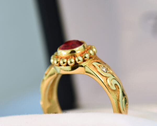 custom carved gold band style ring with bezel set jedi red spinel 3