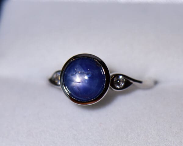 custom round burmese blue star sapphire bezel set engagement ring 2