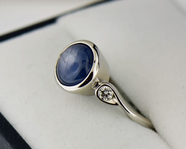 custom round burmese blue star sapphire bezel set engagement ring 4