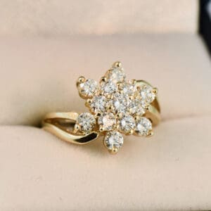 impressive yellow gold and diamond cluster star cocktail ring