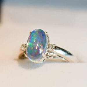 mexican contra luz jelly opal ring with diamonds in white gold
