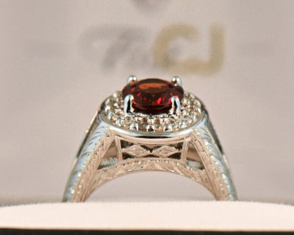 red hessonite garnet and diamond halo ring with carved design 2