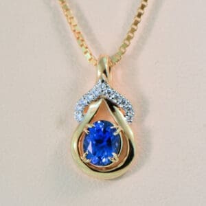 sri lankan cornflower blue sapphire and diamond gold lasso pendant