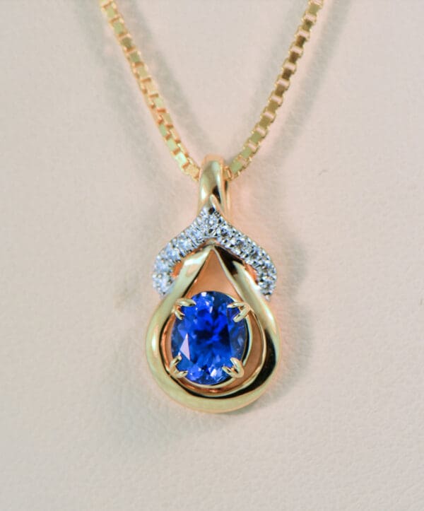sri lankan cornflower blue sapphire and diamond gold lasso pendant
