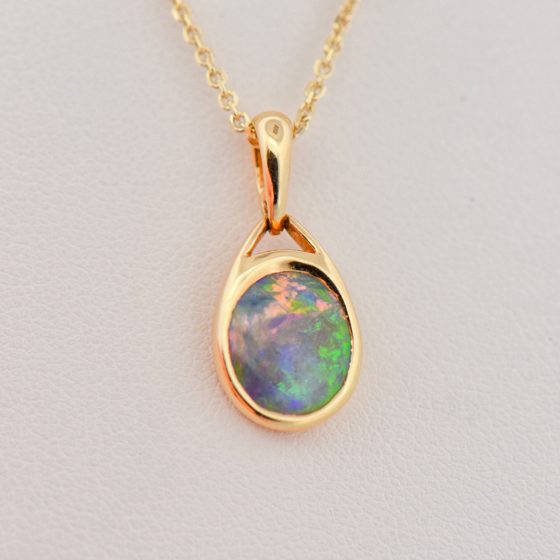 Bezel Set Black Opal Solitaire Pendant 18k | Exquisite Jewelry for